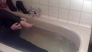 Sexy tight pants ankle boots and heels in bath
