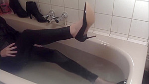 Sexy tight pants ankle boots and heels in bath
