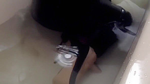 Sexy tight pants ankle boots and heels in bath