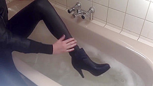 Sexy tight pants ankle boots and heels in bath