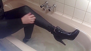 Sexy tight pants ankle boots and heels in bath