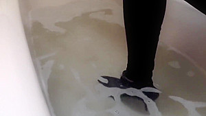 Sexy tight pants ankle boots and heels in bath