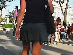 Short skirt of a hot blonde invites a street