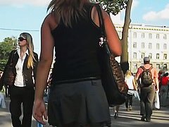 Short skirt of a hot blonde invites a street