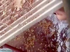 Spying on a topless girl showering outdoors