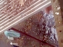 Spying on a topless girl showering outdoors