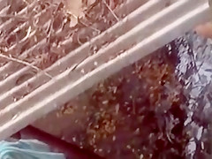 Spying on a topless girl showering outdoors