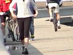 Street candid girl is going to ride her bicycle before cam 03t