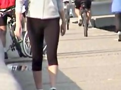 Street candid girl is going to ride her bicycle before cam 03t