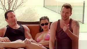 Swinger couples play slippery melon naked in the swiming pool as a warm up foreplay game