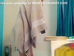 Tattooed redhead opens the bathtub curtain