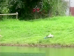 The older woman took a bath in the river