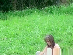 The older woman took a bath in the river