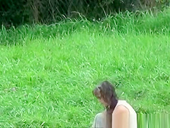 The older woman took a bath in the river