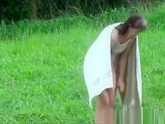 The older woman took a bath in the river