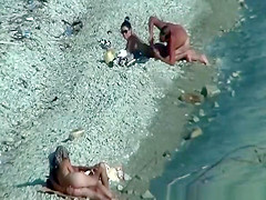 Two nudist couples spied at rocky beach
