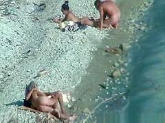 Two nudist couples spied at rocky beach