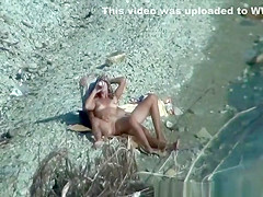 Two nudist couples spied at rocky beach
