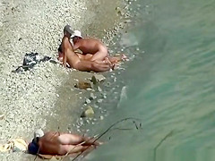 Two nudist couples spied at rocky beach