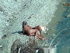 Two nudist couples spied at rocky beach