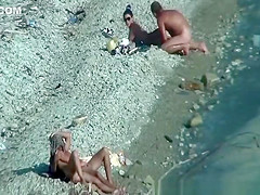 Two nudist couples spied at rocky beach