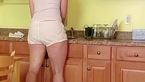 USA milf Christina Sapphire finger fucks herself in the kitchen