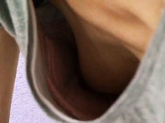 Unhooked bra exposes amateur Asian
