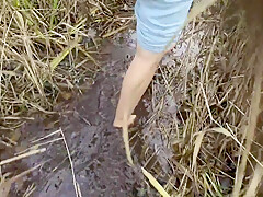 Walking Barefoot In A Swampy Bog - Muddy Feet