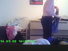 Wife in bedroom dressing her clothes