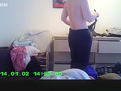 Wife in bedroom dressing her clothes