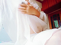 Woman In White Dress Masturbates In Bedroom