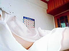 Woman In White Dress Masturbates In Bedroom