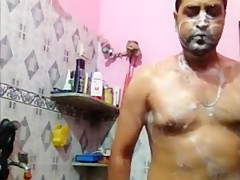 indian man taking bath nude