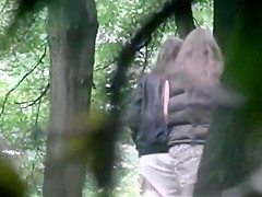 is spying and recording two girl pissing in the wood