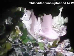 is spying and recording two girl pissing in the wood