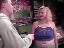 mature woman fucks in the garage with young guy